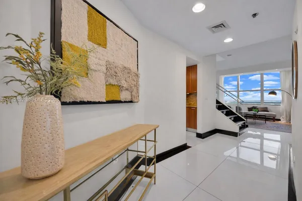 a room with gym equipment and a large window