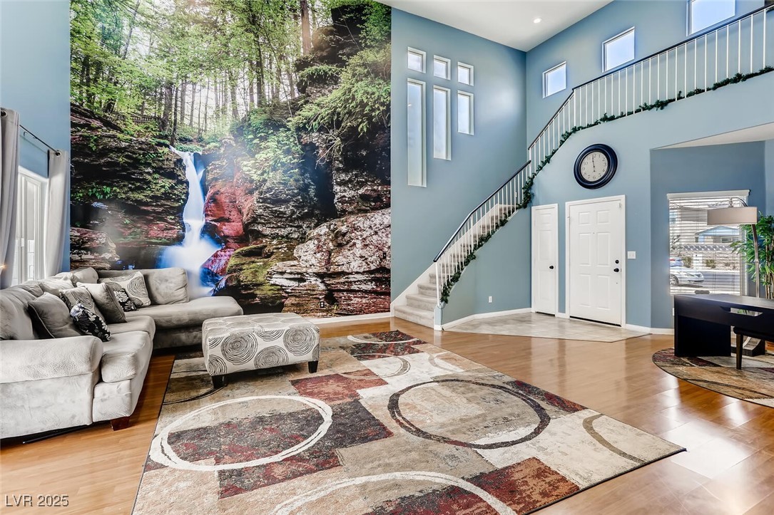 7237 West Mesa Vista Avenue Las Vegas, NV 89113 - Photo 16 of 26 Living area with wood finished floors, stairway, a