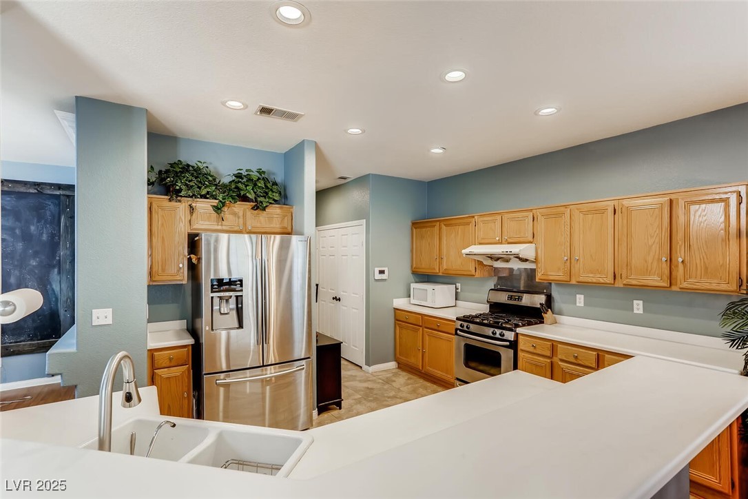 7237 West Mesa Vista Avenue Las Vegas, NV 89113 - Photo 18 of 26 Kitchen featuring appliances with stainless steel