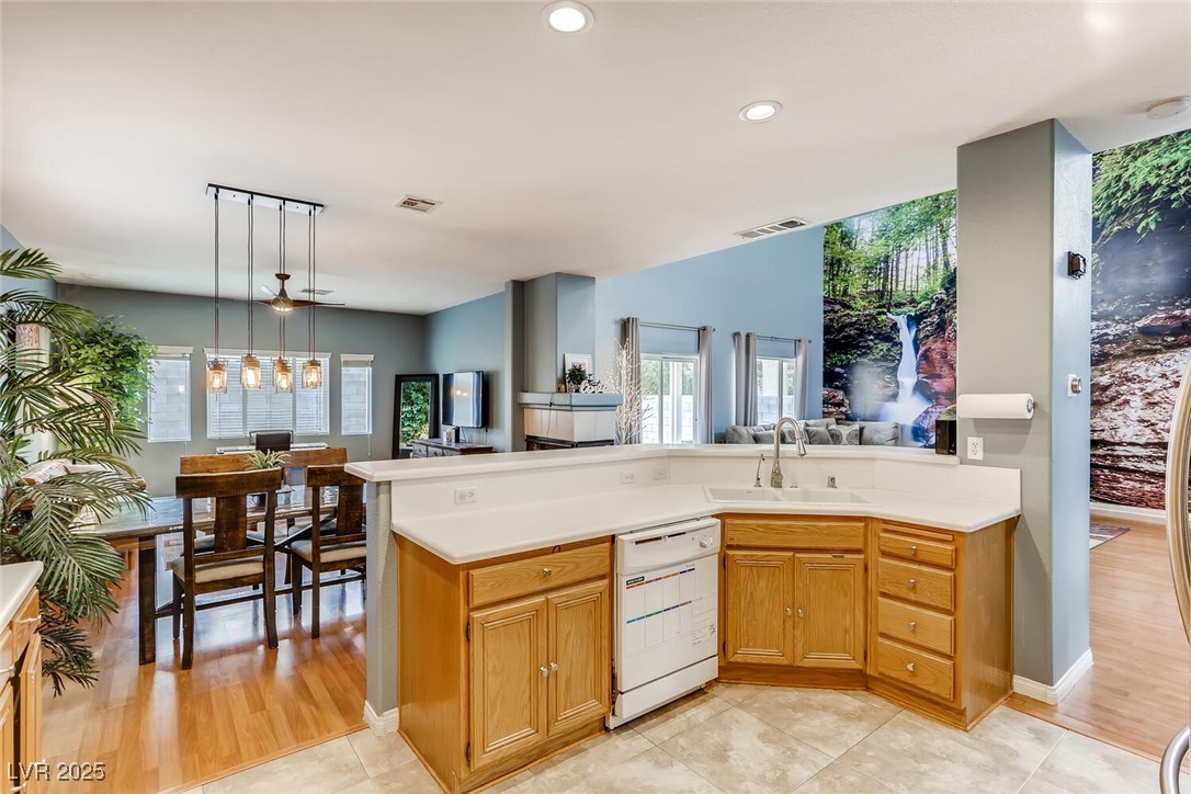 7237 West Mesa Vista Avenue Las Vegas, NV 89113 - Photo 20 of 26 Kitchen with white dishwasher, light countertops,