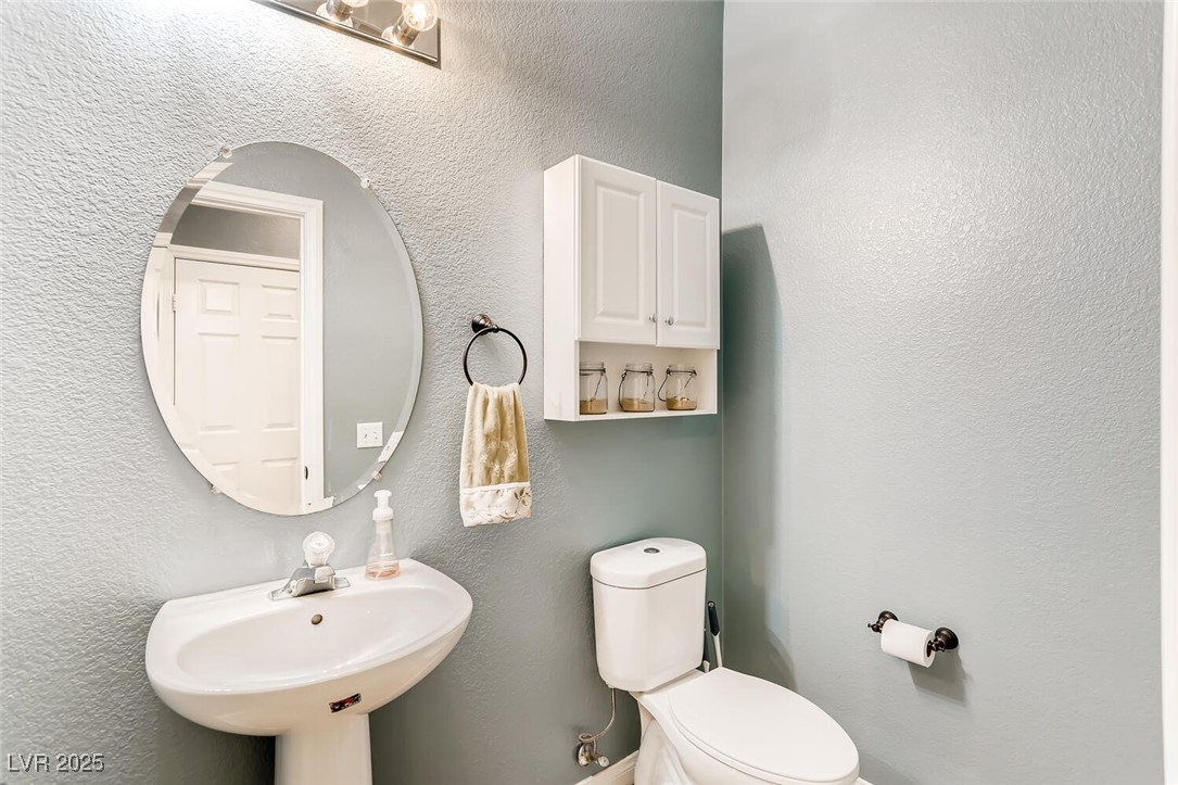 7237 West Mesa Vista Avenue Las Vegas, NV 89113 - Photo 21 of 26 Half bath with a textured wall