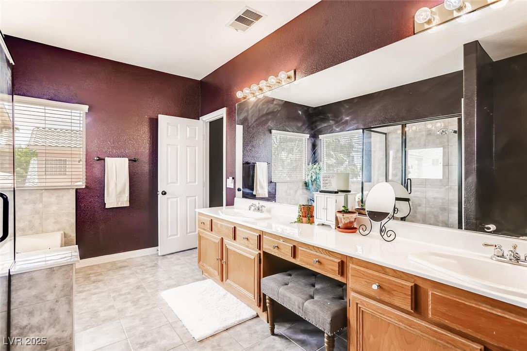 7237 West Mesa Vista Avenue Las Vegas, NV 89113 - Photo 23 of 26 Full bathroom featuring a textured wall, double va