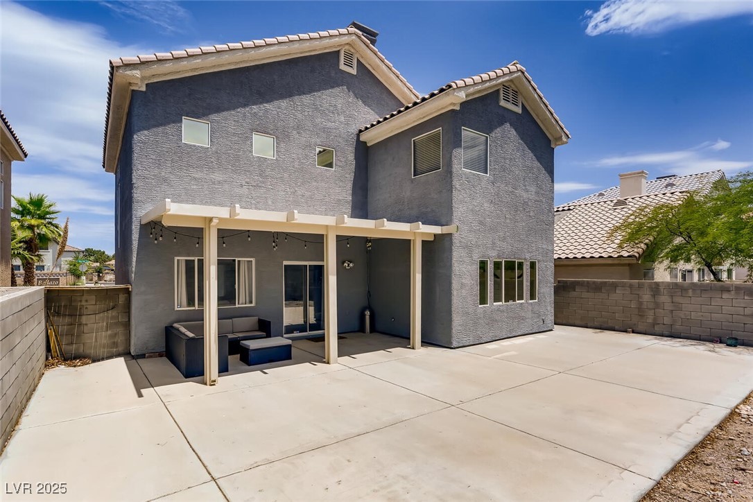 7237 West Mesa Vista Avenue Las Vegas, NV 89113 - Photo 26 of 26 Back of property with a patio, stucco siding, a fe