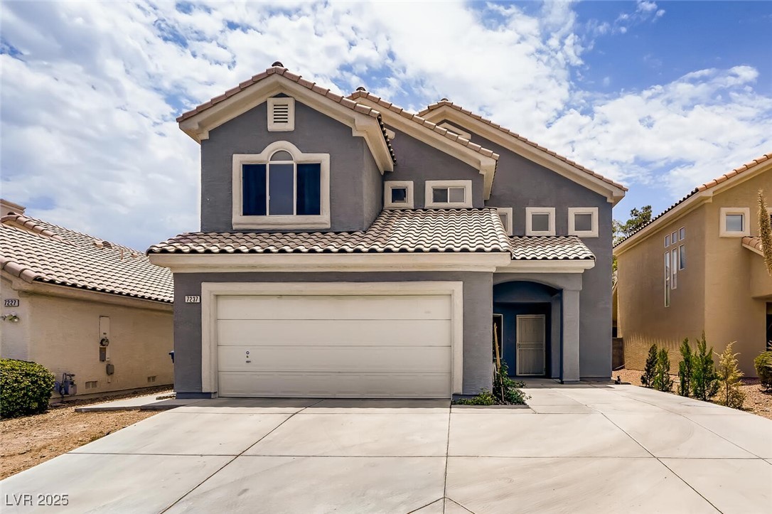 7237 West Mesa Vista Avenue Las Vegas, NV 89113 - Photo 3 of 26 Mediterranean / spanish home with concrete drivewa