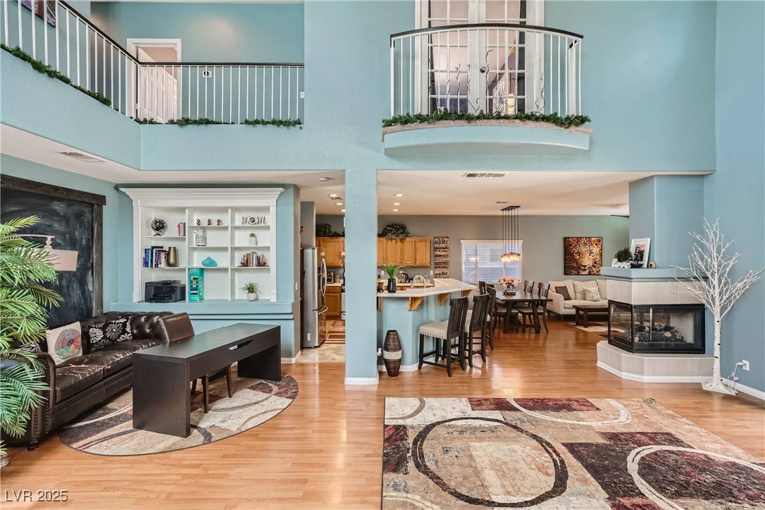 7237 West Mesa Vista Avenue Las Vegas, NV 89113 - Photo 4 of 26 Living area featuring light wood-style floors and