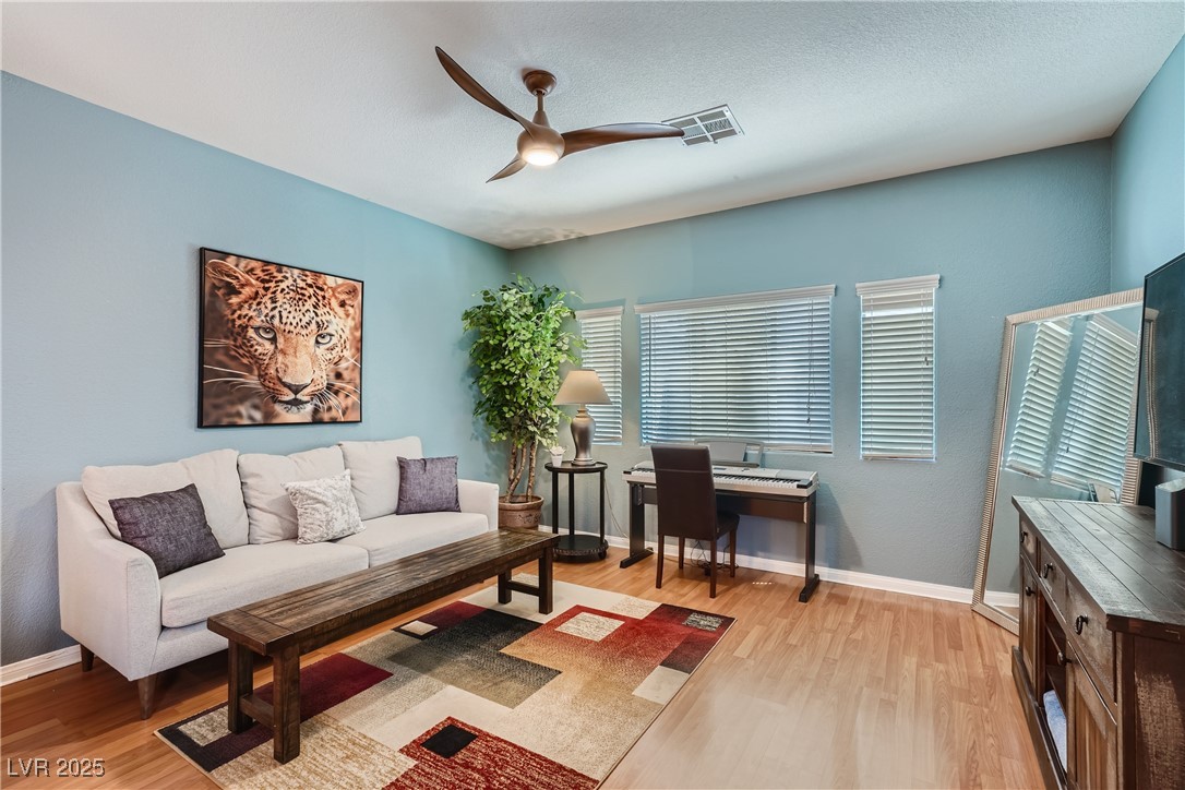 7237 West Mesa Vista Avenue Las Vegas, NV 89113 - Photo 7 of 26 Living area featuring light wood-style flooring, a