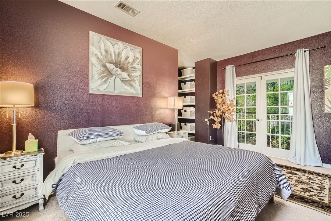 7237 West Mesa Vista Avenue Las Vegas, NV 89113 - Photo 10 of 26 Carpeted bedroom with access to outside, french do