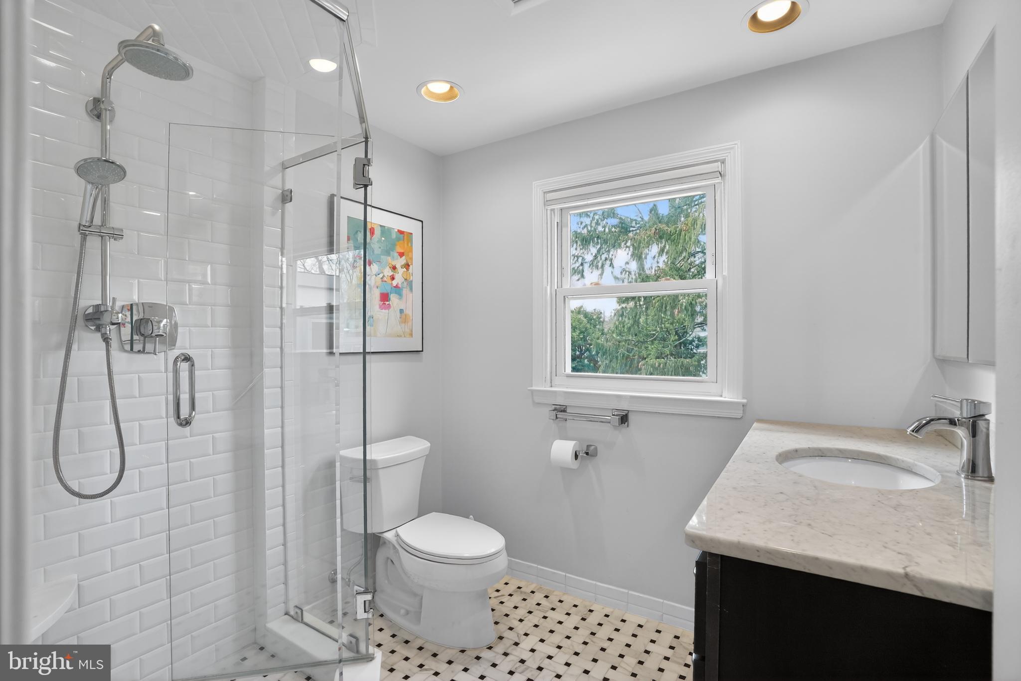 211 Fairfield Drive Wallingford, PA 19086 - Photo 15 of 29 a bathroom with a granite countertop sink a toilet and shower