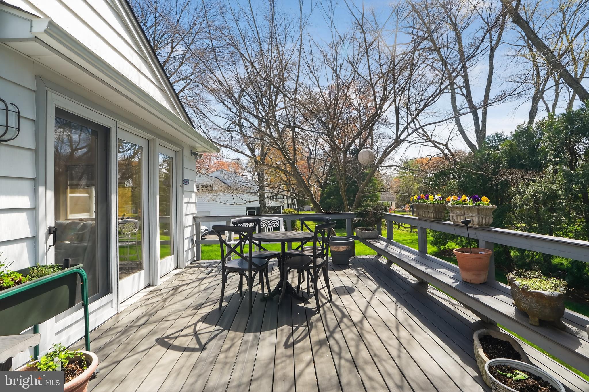 211 Fairfield Drive Wallingford, PA 19086 - Photo 21 of 29 a view of a patio with table and chairs wooden floor and fence