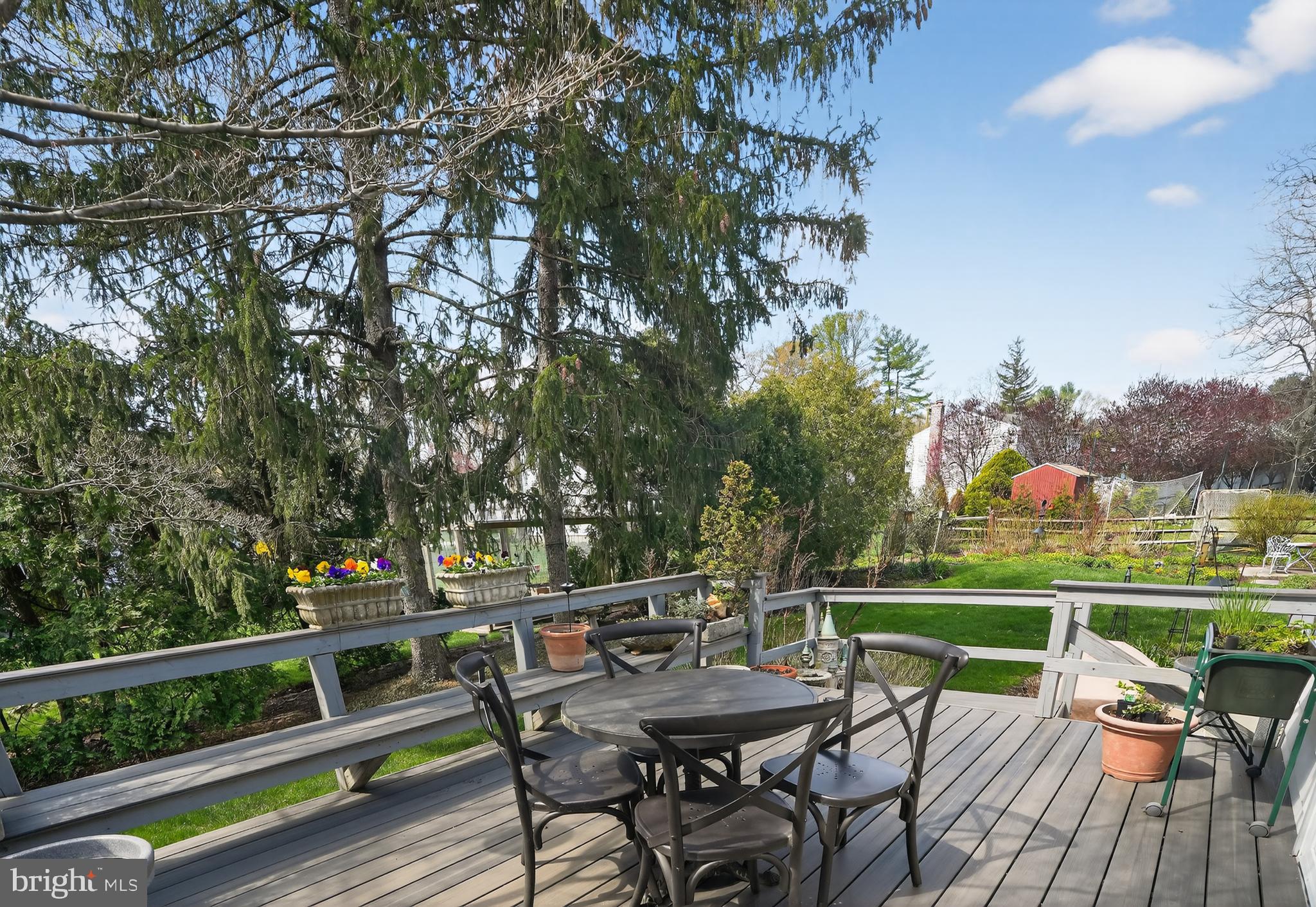 211 Fairfield Drive Wallingford, PA 19086 - Photo 22 of 29 a view of a chairs and table on the deck