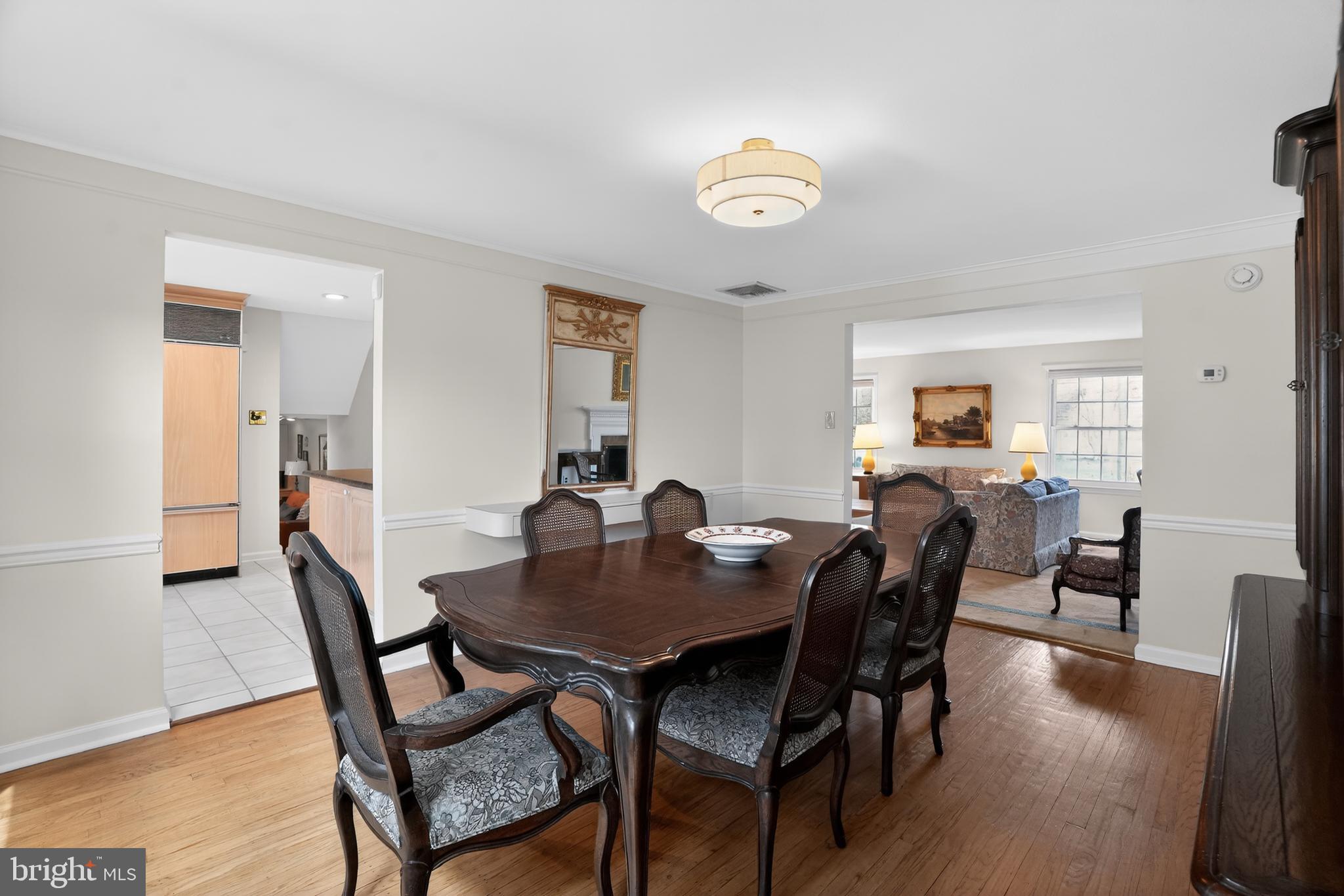 211 Fairfield Drive Wallingford, PA 19086 - Photo 4 of 29 a view of a dining room with furniture and wooden floor