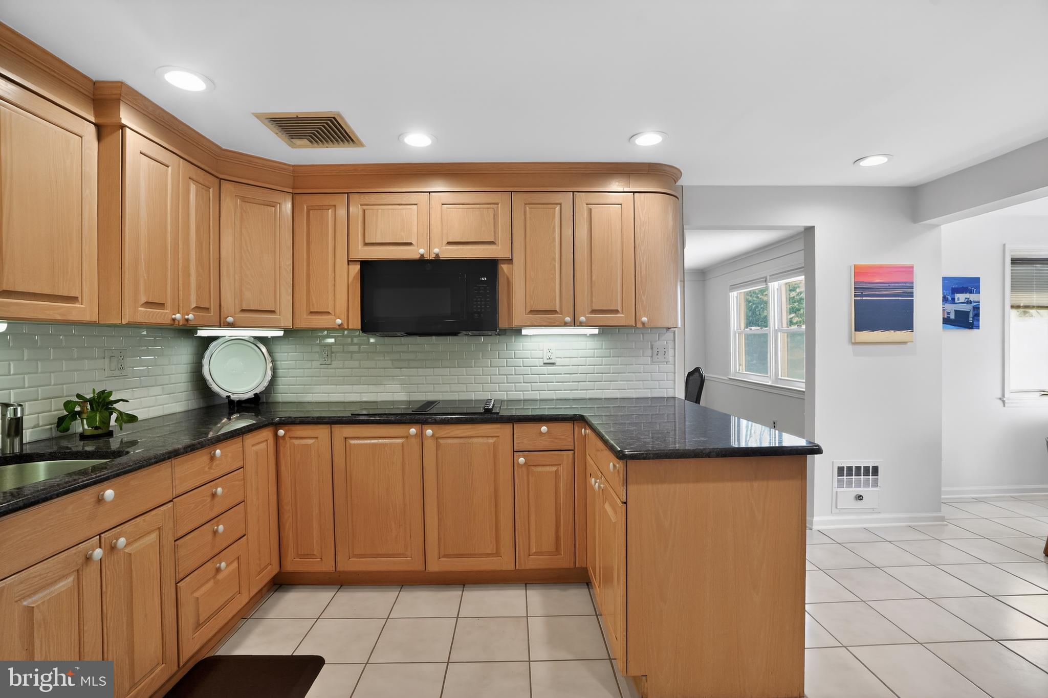 211 Fairfield Drive Wallingford, PA 19086 - Photo 6 of 29 a kitchen with stainless steel appliances granite countertop a sink and a stove