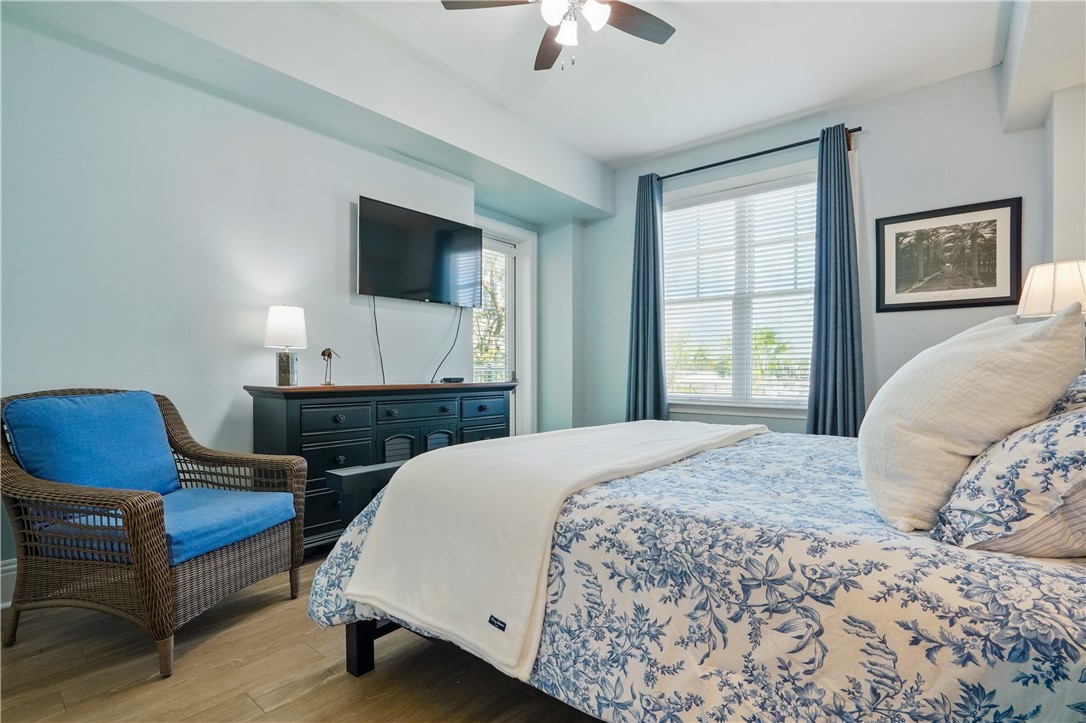 20 Waterfront Drive, Unit 121 St. Simons Island, GA 31522 - Photo 12 of 42 Primary bedroom overlooks the marina and your own private access to the balcony to take in the waterfront views and ever changing sky's.