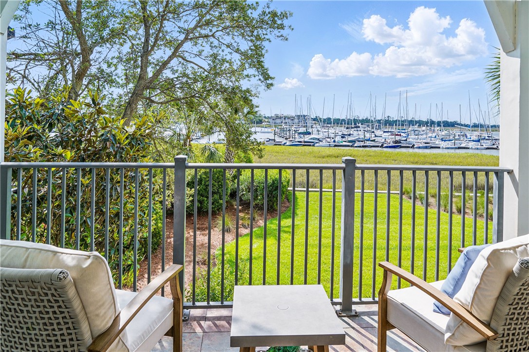 20 Waterfront Drive, Unit 121 St. Simons Island, GA 31522 - Photo 3 of 42 Enjoy soft breezes while enjoying the calm from your balcony terrace.