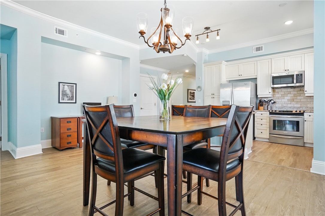 20 Waterfront Drive, Unit 121 St. Simons Island, GA 31522 - Photo 8 of 42 High top dining area and island for gathering and enjoying meals together.