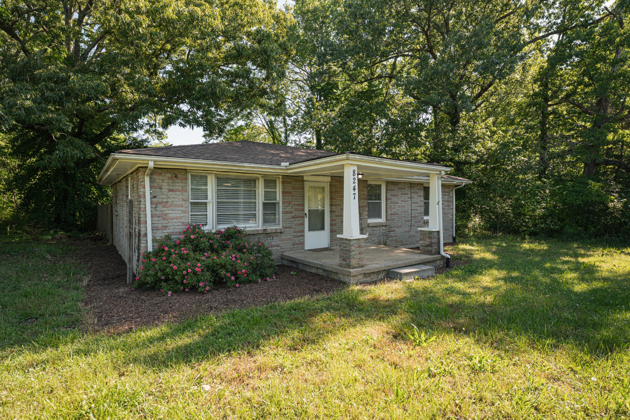 8247 Pinewood Road Nunnelly, TN 37137 - Photo 1 of 14 a view of front of house with a yard