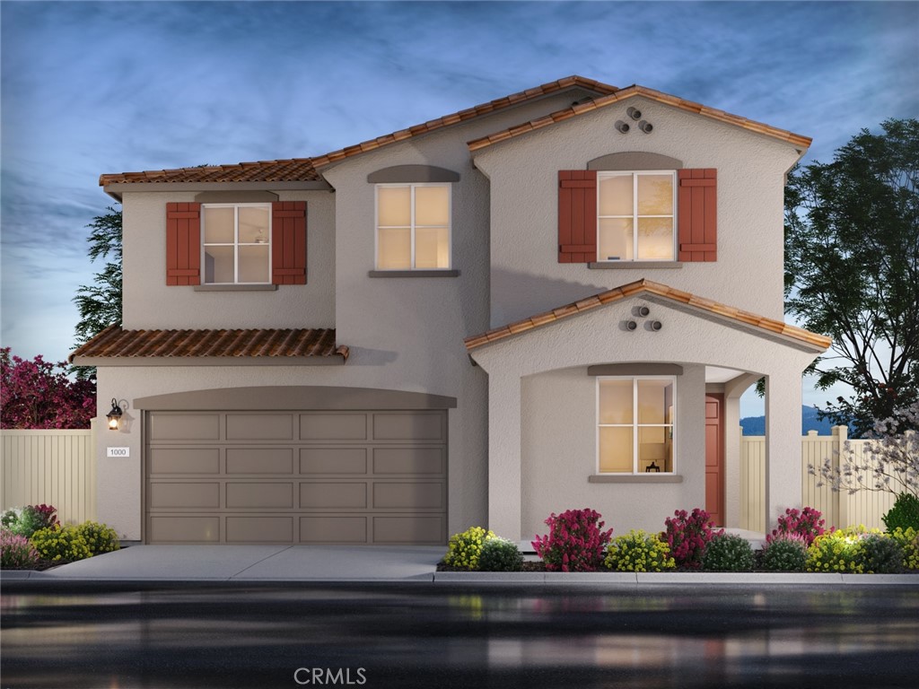 a front view of a house with yard