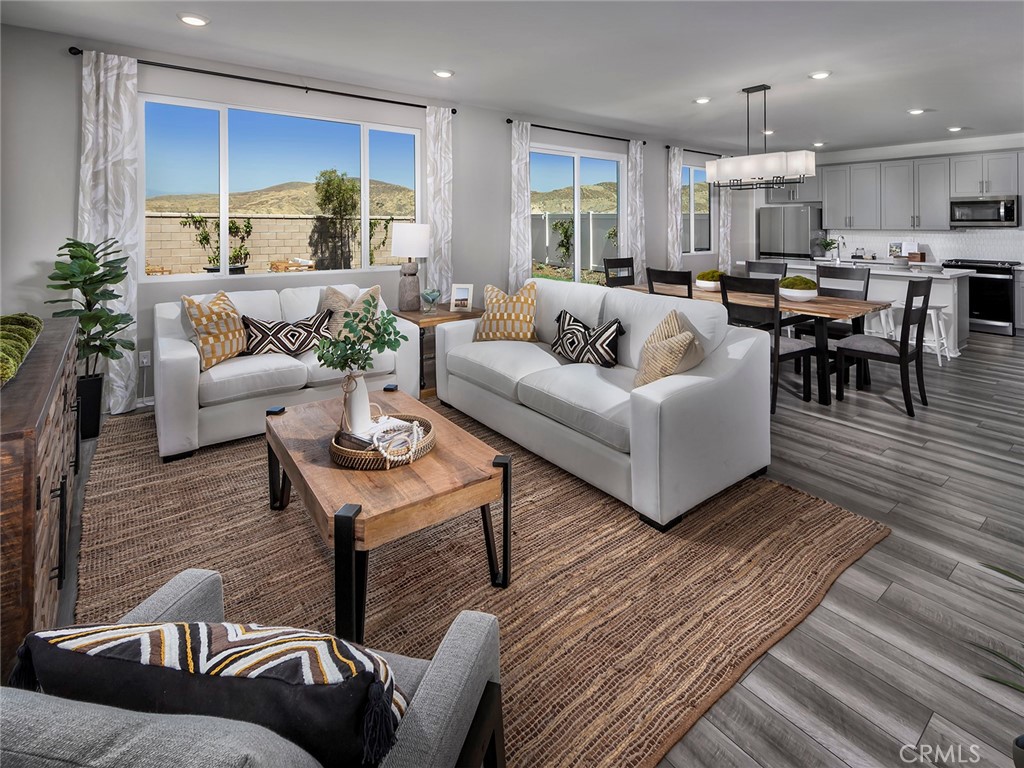 2049 Tangelo Lane Redlands, CA 92374 - Photo 5 of 15 a living room with furniture kitchen and a table