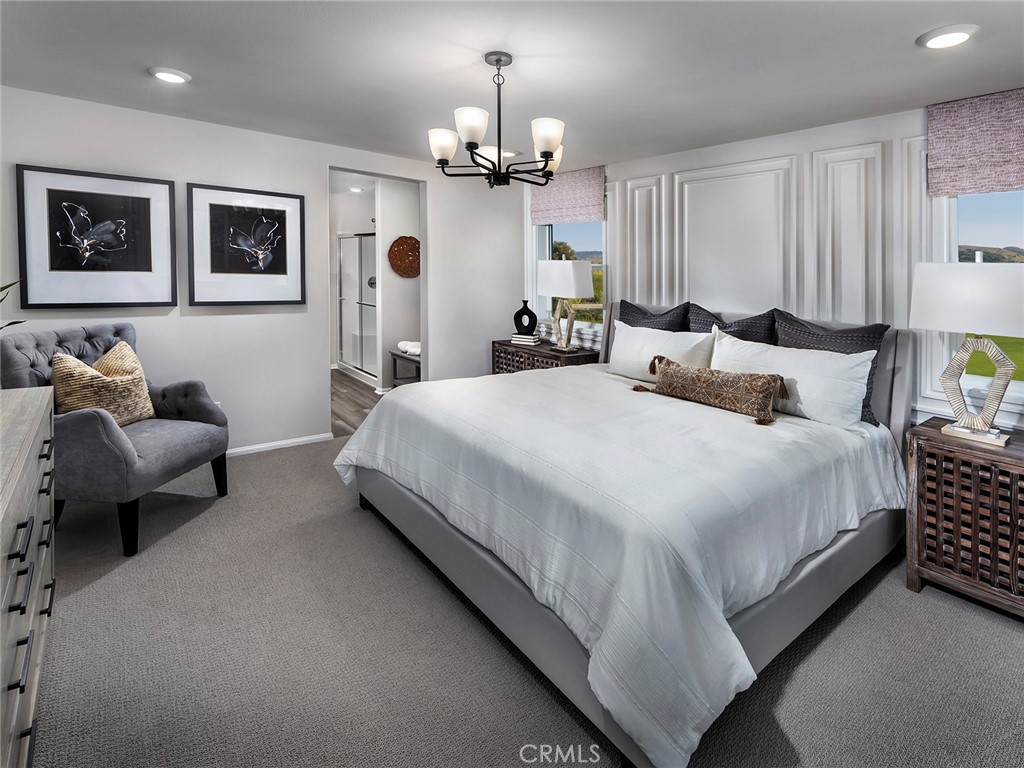 2049 Tangelo Lane Redlands, CA 92374 - Photo 10 of 15 a bedroom with bed and a chandelier