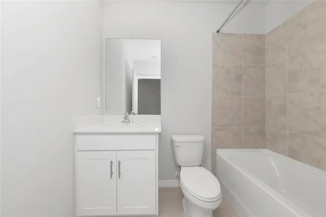 a view of an empty room and a window