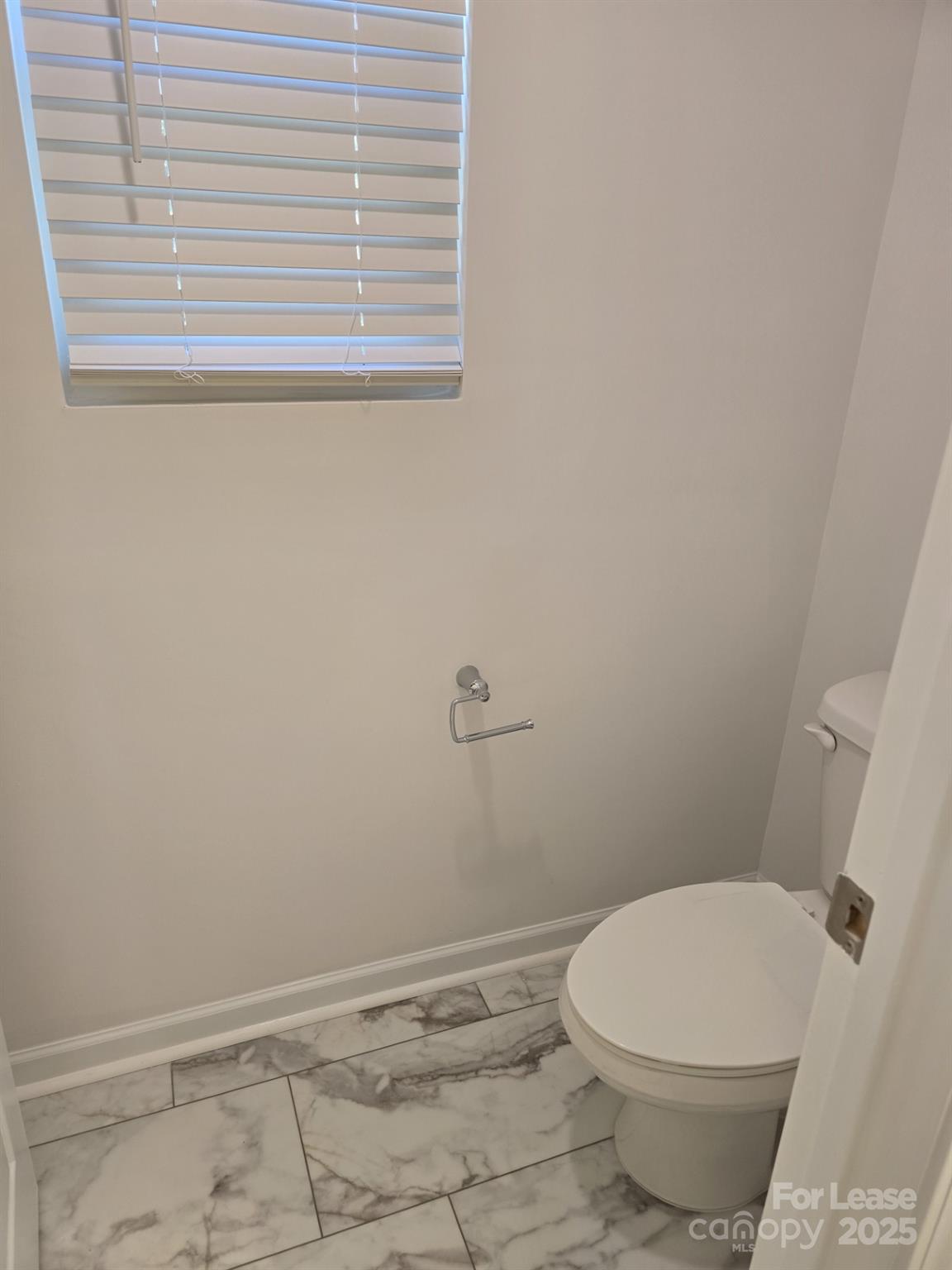 3519 Secrest Landing Monroe, NC 28110 - Photo 20 of 25 a white toilet sitting next to a window