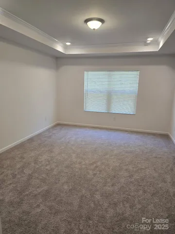 an empty room with a empty space and windows