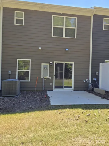 a house view with a swimming pool in front of it