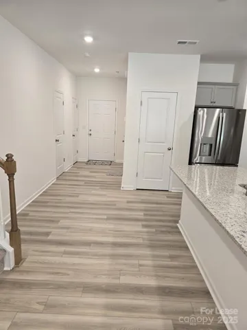a view of a kitchen from the hallway