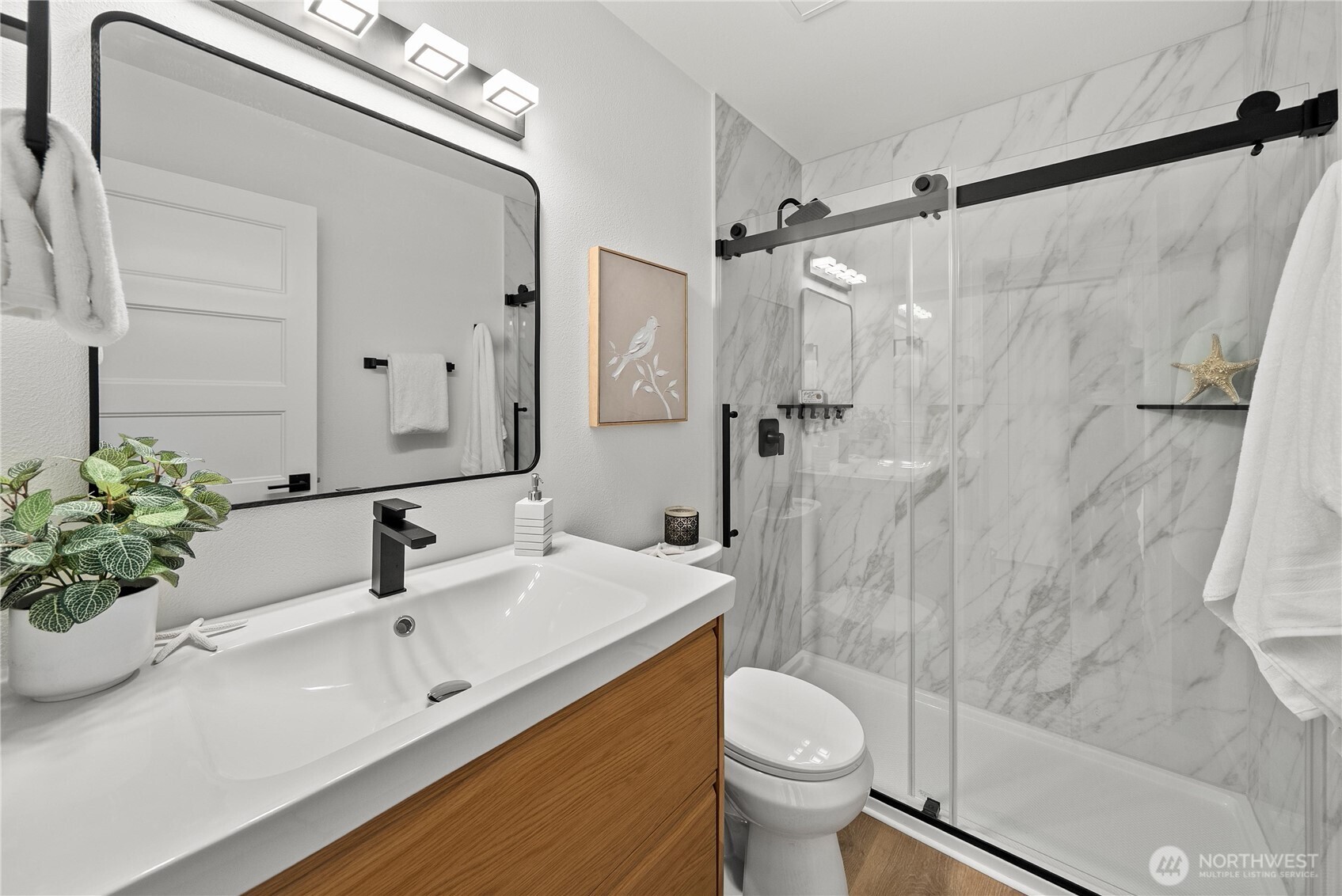 4226 Beach Drive Southwest, Unit 102 Seattle, WA 98116 - Photo 11 of 20 a bathroom with a sink toilet and shower