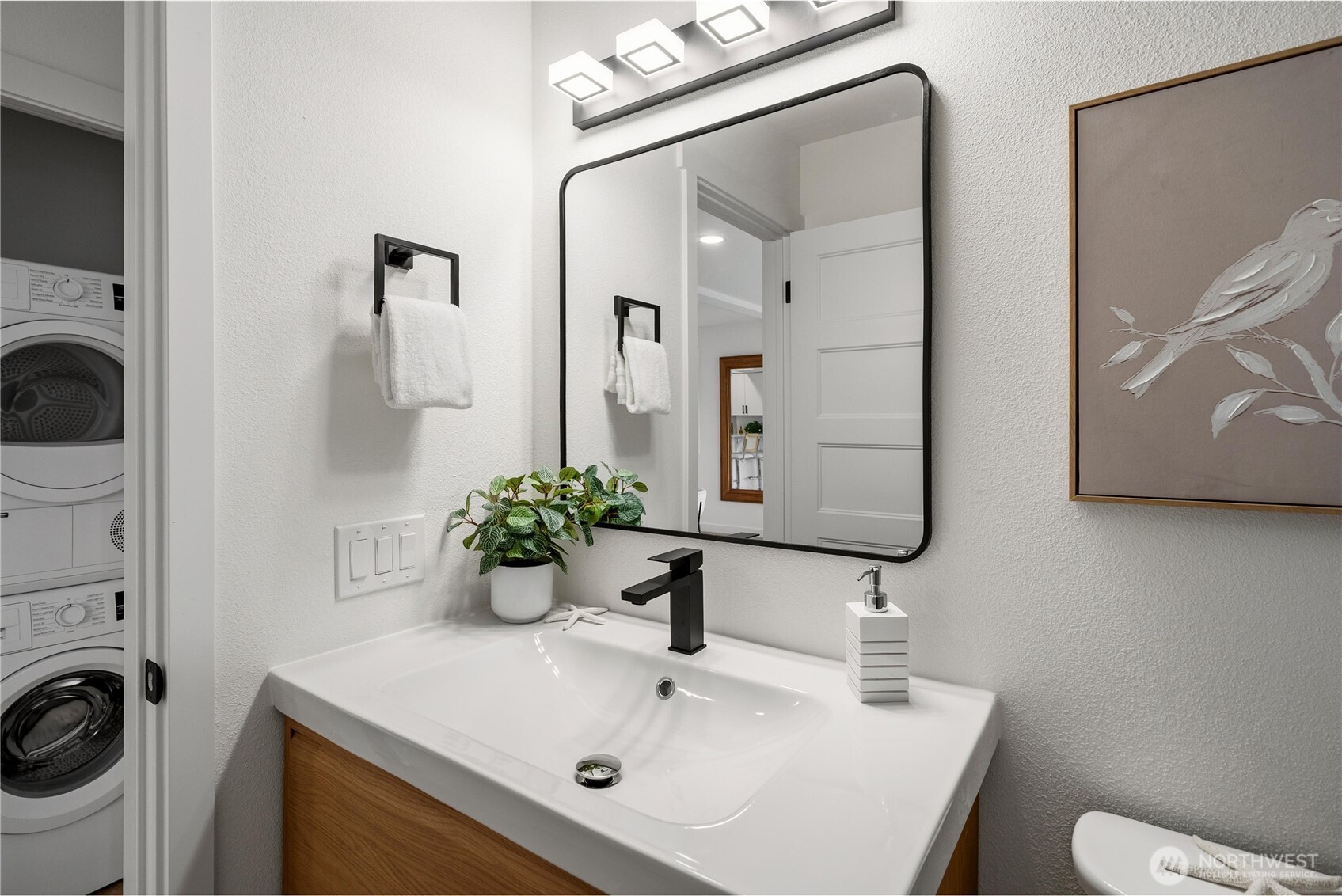 4226 Beach Drive Southwest, Unit 102 Seattle, WA 98116 - Photo 12 of 20 a bathroom with a sink and a mirror