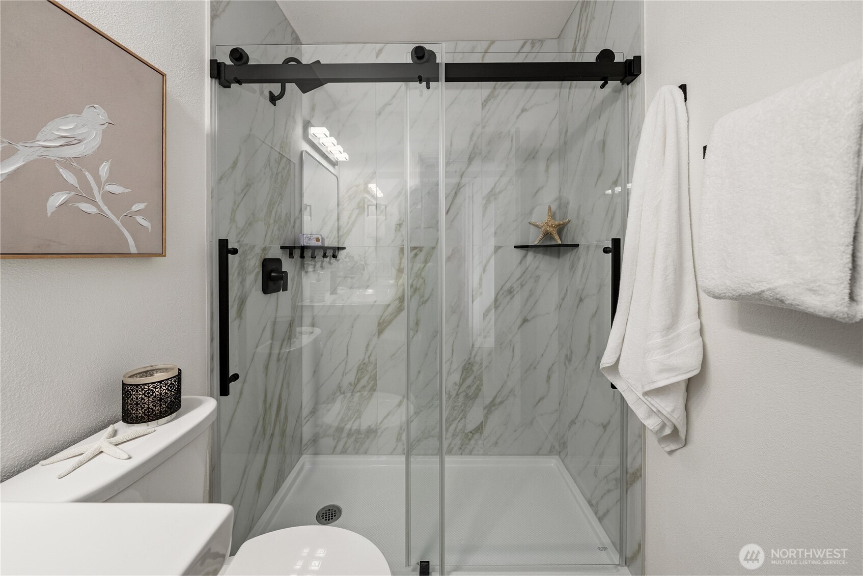 4226 Beach Drive Southwest, Unit 102 Seattle, WA 98116 - Photo 13 of 20 a bathroom with a sink toilet and shower
