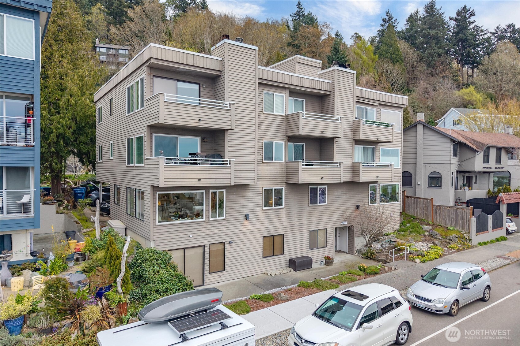 4226 Beach Drive Southwest, Unit 102 Seattle, WA 98116 - Photo 18 of 20 a view of a patio filled with furniture