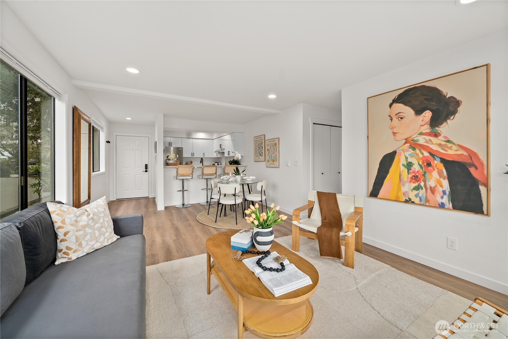 4226 Beach Drive Southwest, Unit 102 Seattle, WA 98116 - Photo 6 of 20 a living room with furniture and a flat screen tv