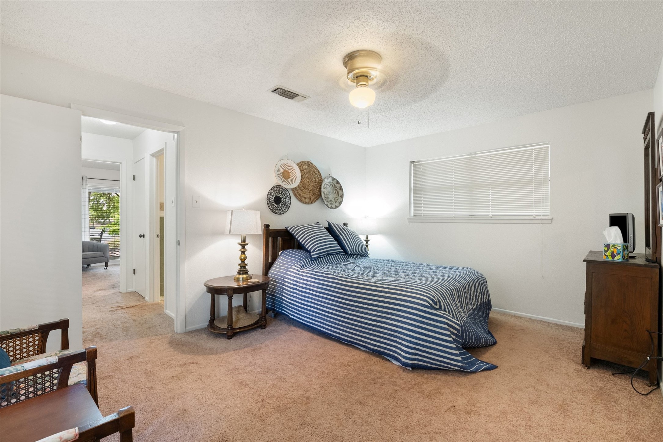 141 Perry Lane Kingsland, TX 78639 - Photo 37 of 40 A comforting retreat, this bedroom offers a plush carpeted floor and an overhead light fixture for evening ambiance.