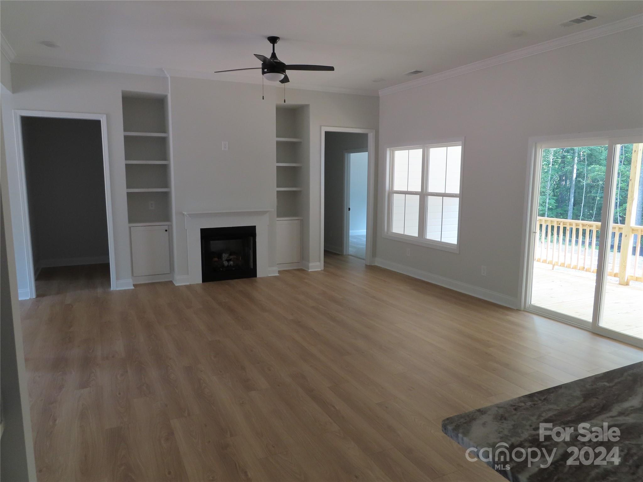 2225 Cedar Road, Unit 1 York, SC 29745 - Photo 13 of 31 a view of an empty room with wooden floor and a window