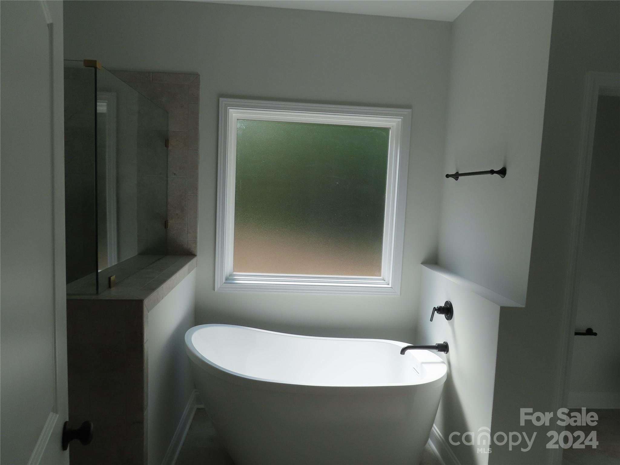 2225 Cedar Road, Unit 1 York, SC 29745 - Photo 21 of 31 a bath tub sitting in a bathroom next to a window