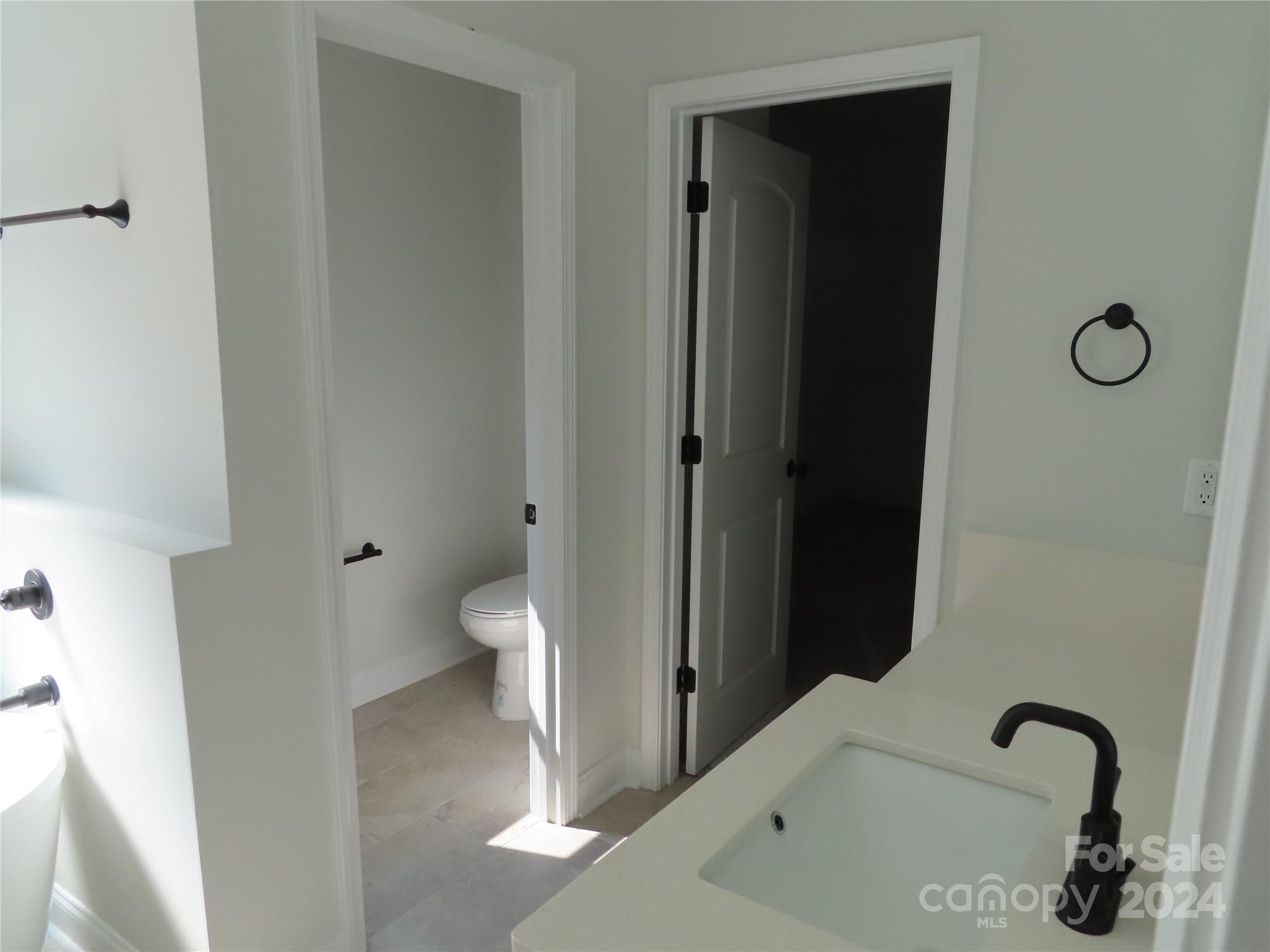 2225 Cedar Road, Unit 1 York, SC 29745 - Photo 22 of 31 a bathroom with a granite countertop sink and a toilet