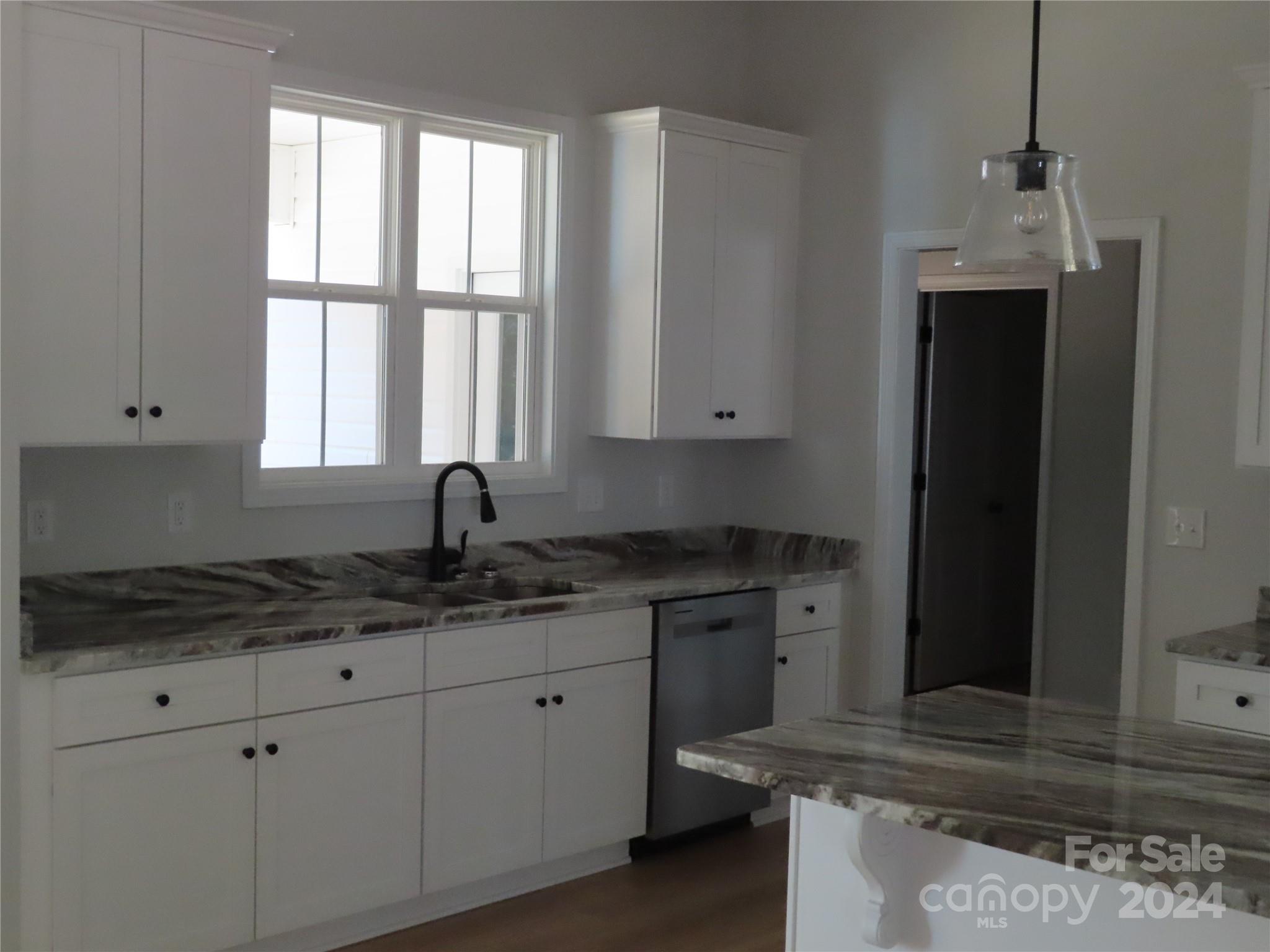 2225 Cedar Road, Unit 1 York, SC 29745 - Photo 10 of 31 a kitchen with stainless steel appliances granite countertop white cabinets and window