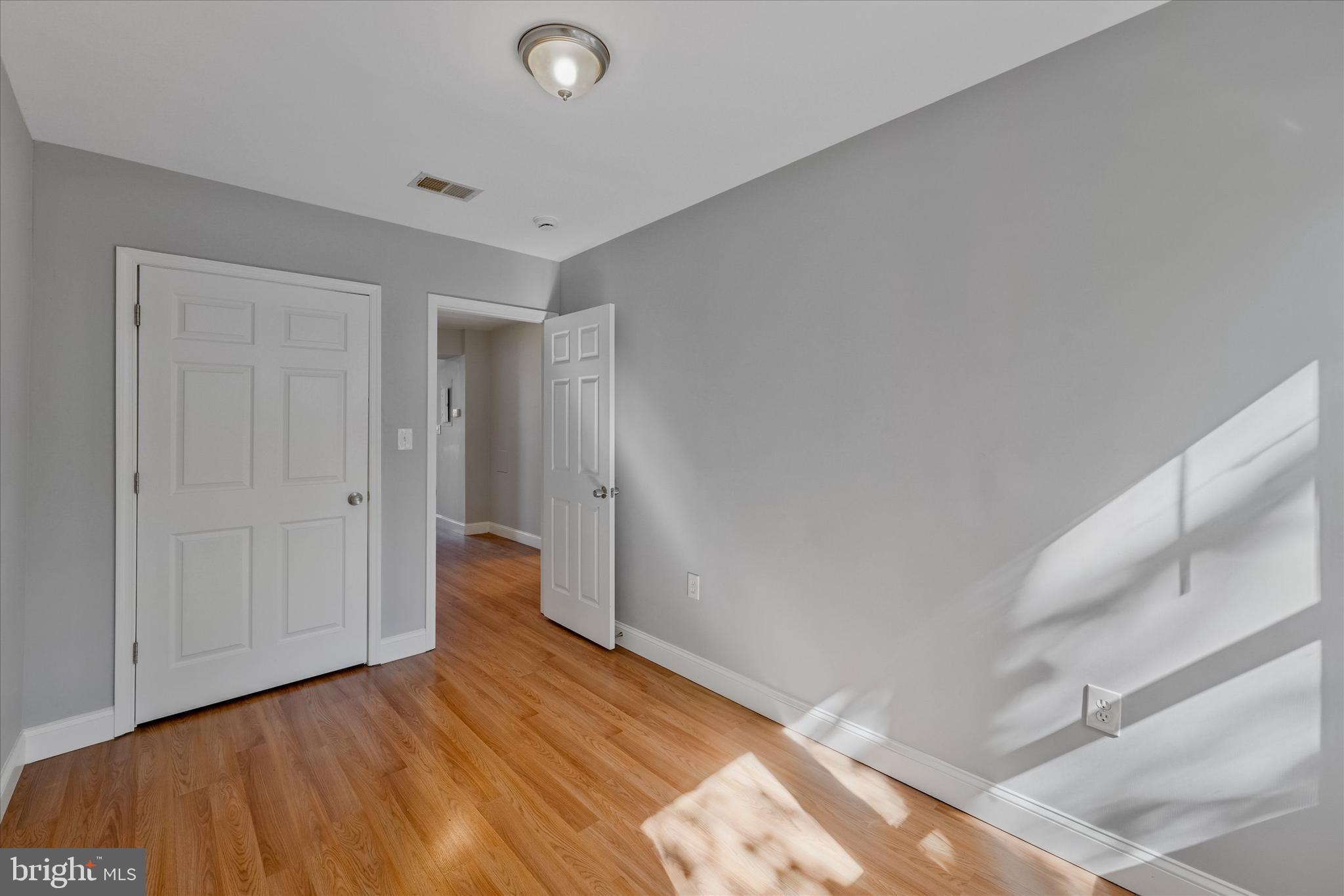 433 Atlantic Street Southeast Washington, DC 20032 - Photo 12 of 15 a view of empty room with wooden floor