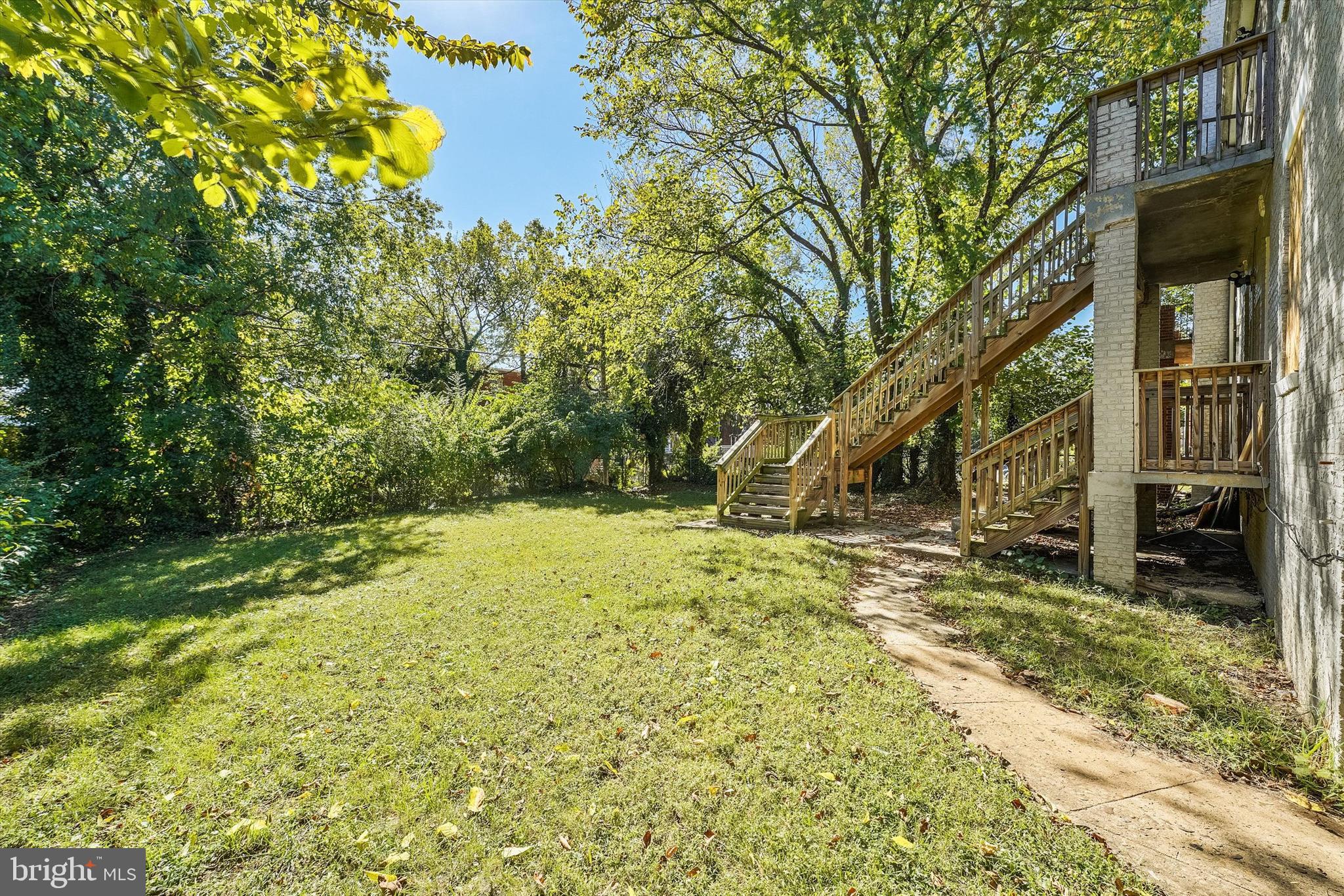 433 Atlantic Street Southeast Washington, DC 20032 - Photo 13 of 15 a view of a yard with plants and trees