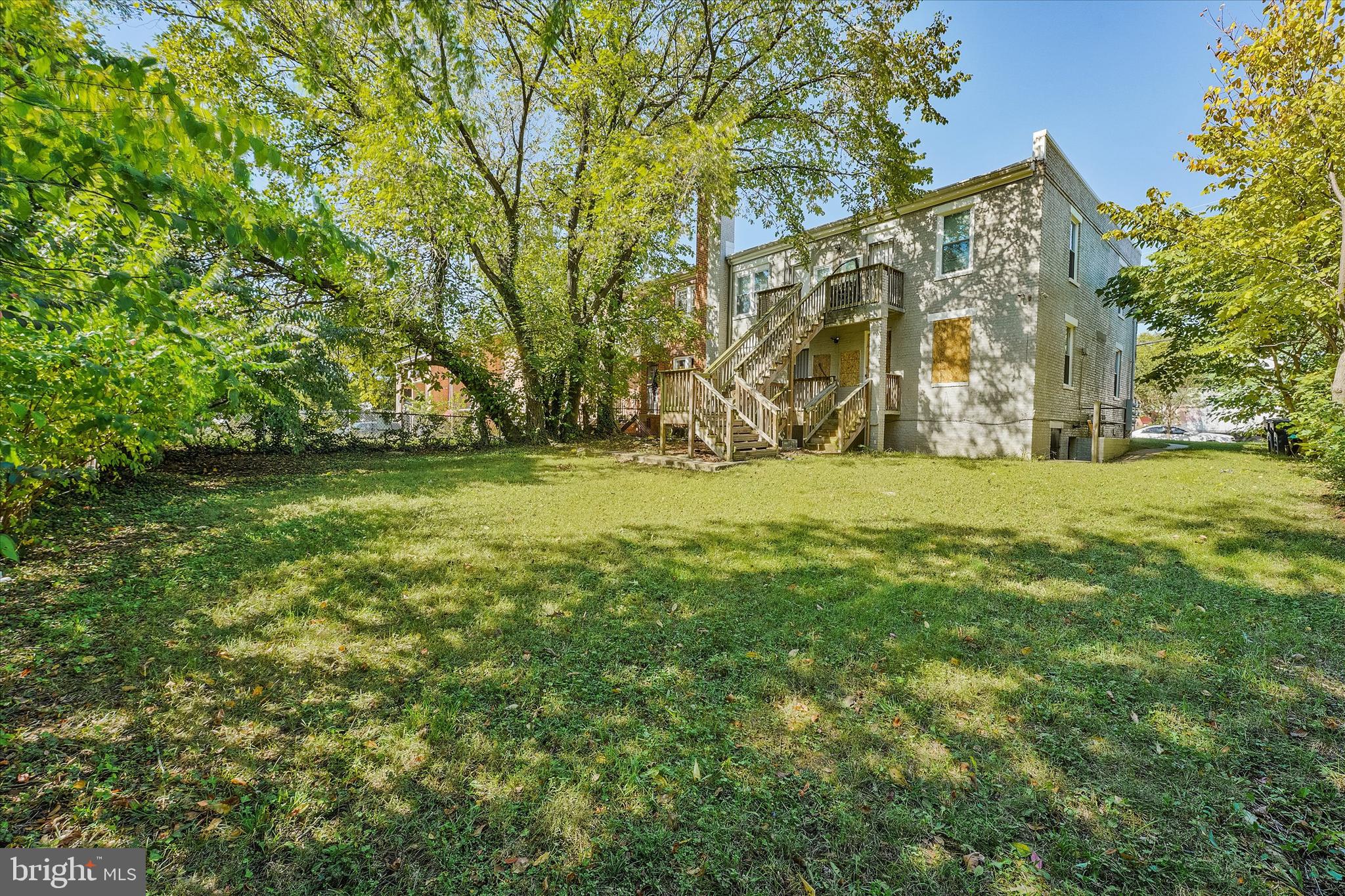 433 Atlantic Street Southeast Washington, DC 20032 - Photo 14 of 15 a view of a big room with a big yard and large trees