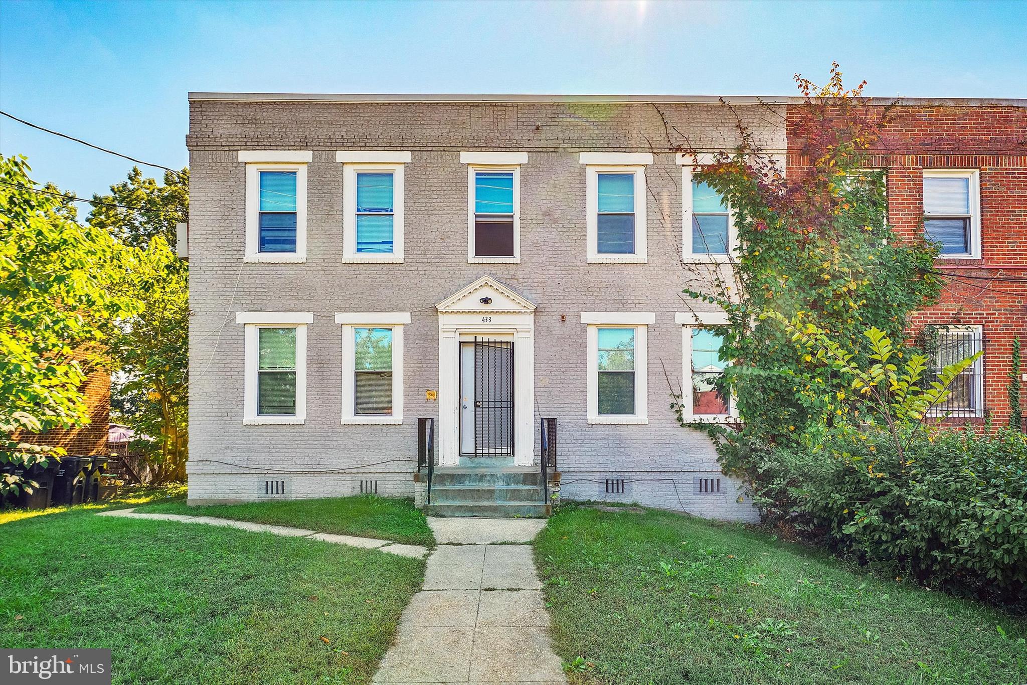 433 Atlantic Street Southeast Washington, DC 20032 - Photo 2 of 15 front view of a house with a yard