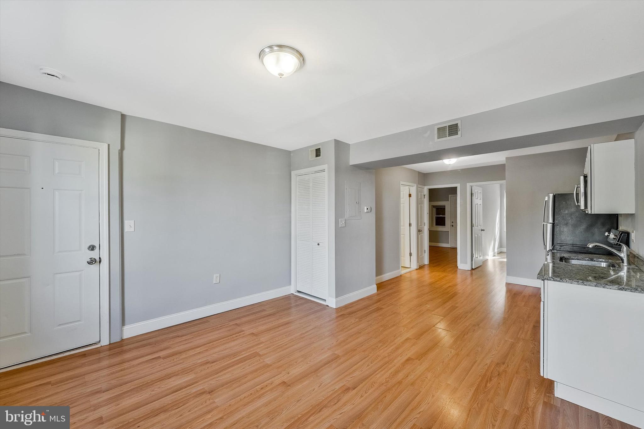 433 Atlantic Street Southeast Washington, DC 20032 - Photo 7 of 15 a view of a livingroom with wooden floor