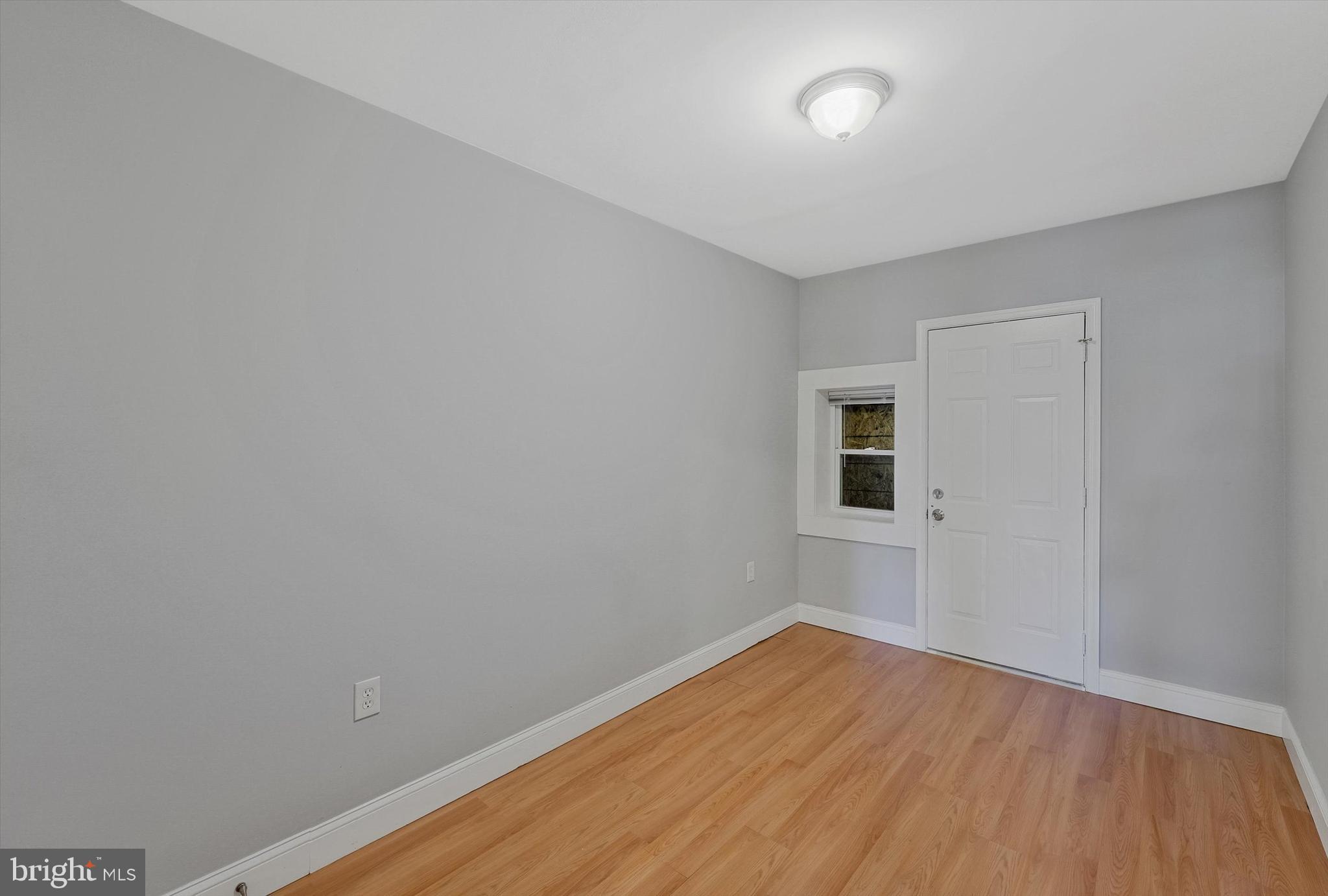 433 Atlantic Street Southeast Washington, DC 20032 - Photo 8 of 15 a view of a room with wooden floor and fan