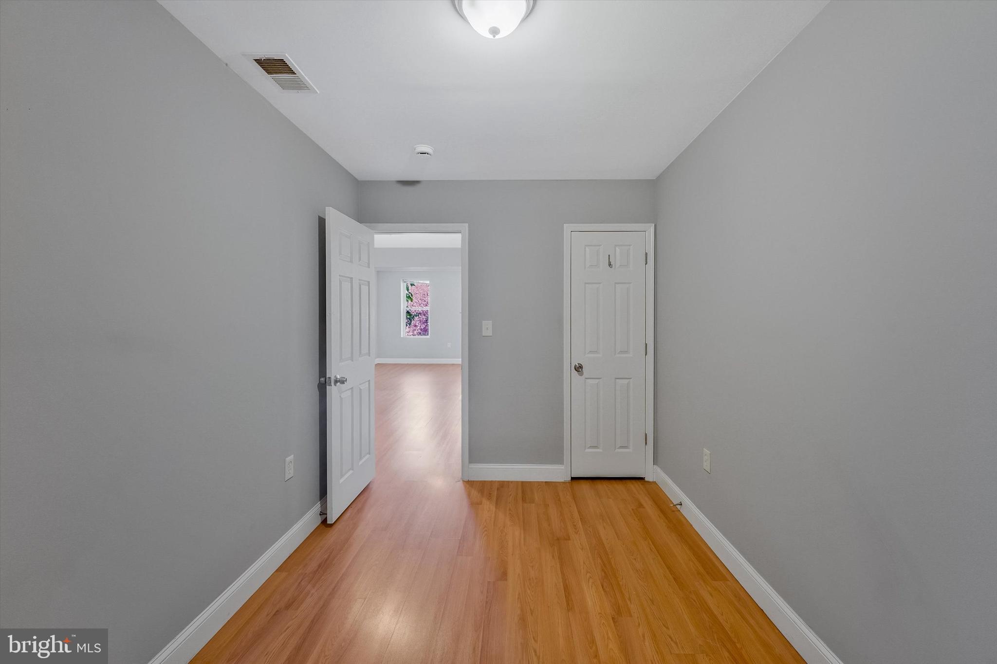 433 Atlantic Street Southeast Washington, DC 20032 - Photo 9 of 15 a view of a hallway with wooden floor