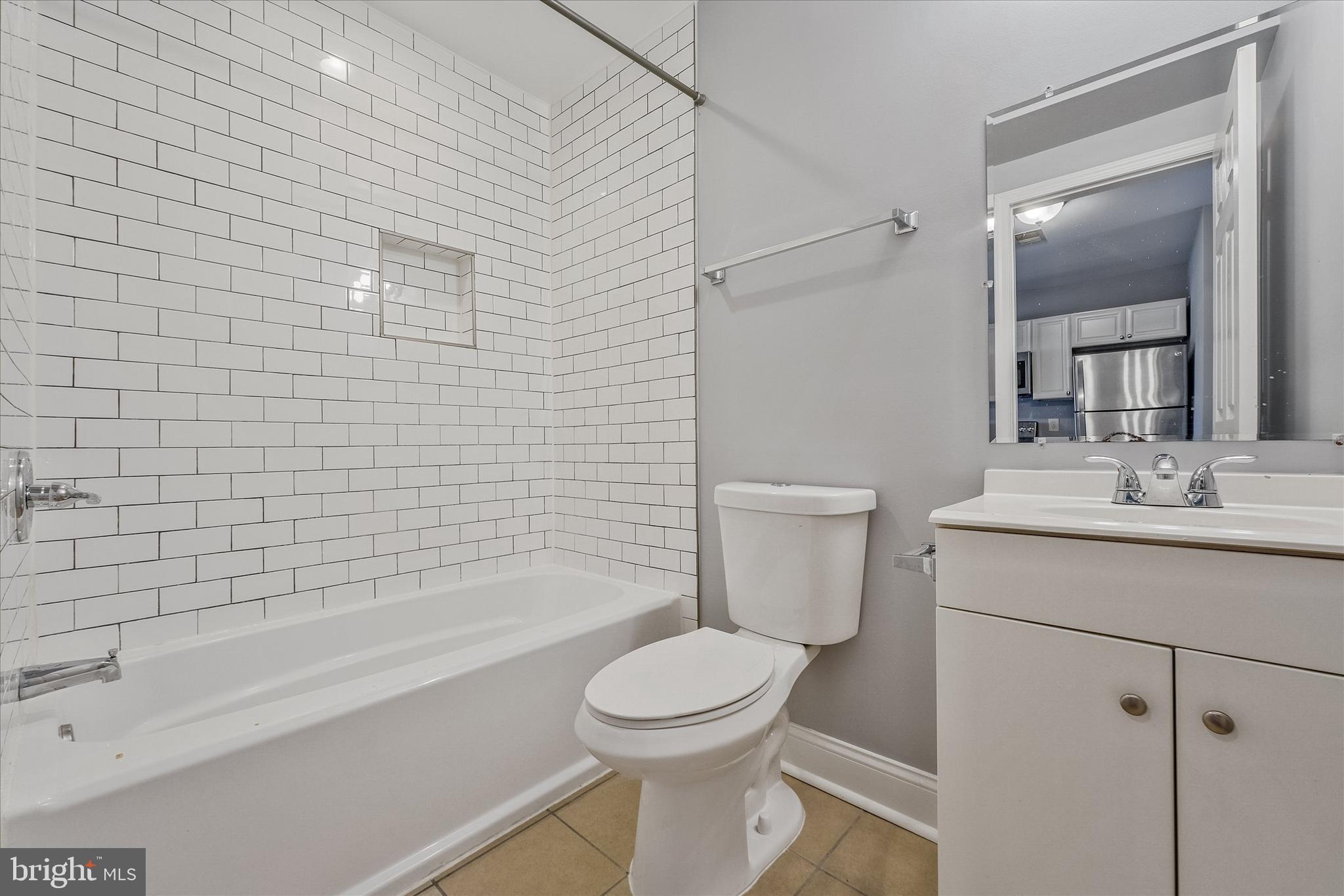 433 Atlantic Street Southeast Washington, DC 20032 - Photo 10 of 15 a bathroom with a sink a toilet and shower