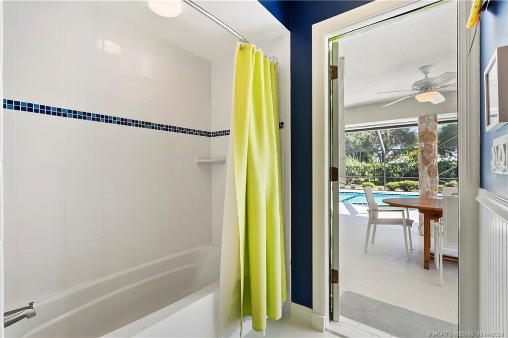 4620 Southeast Quail Trail Stuart, FL 34997 - Photo 23 of 71 a bathroom with a bathtub and a shower