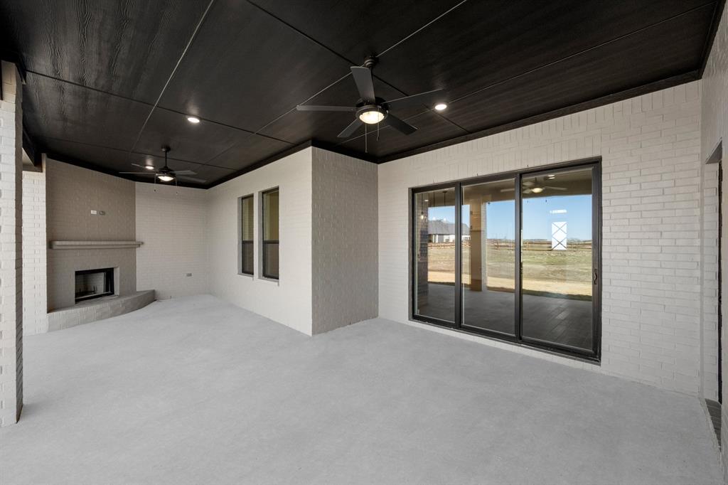 4867 Prairie Sky Lane DISH, TX 76247 - Photo 5 of 27 a view of an empty room with a fireplace and a window