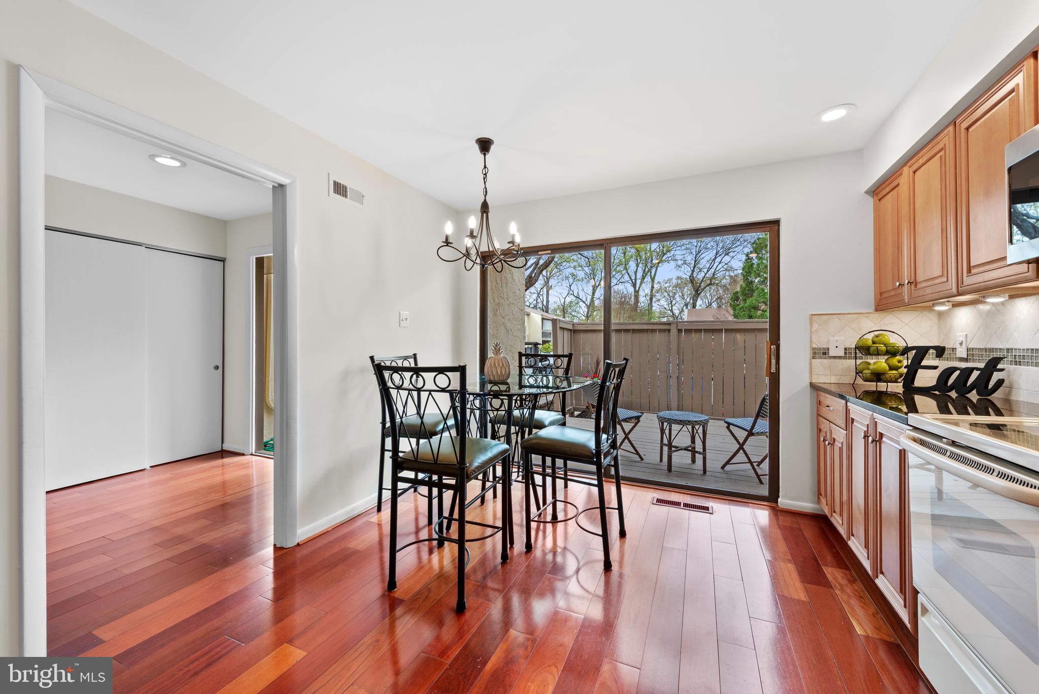 11711 Newbridge Court Reston, VA 20191 - Photo 12 of 37 a view of a dining room with furniture window and wooden floor