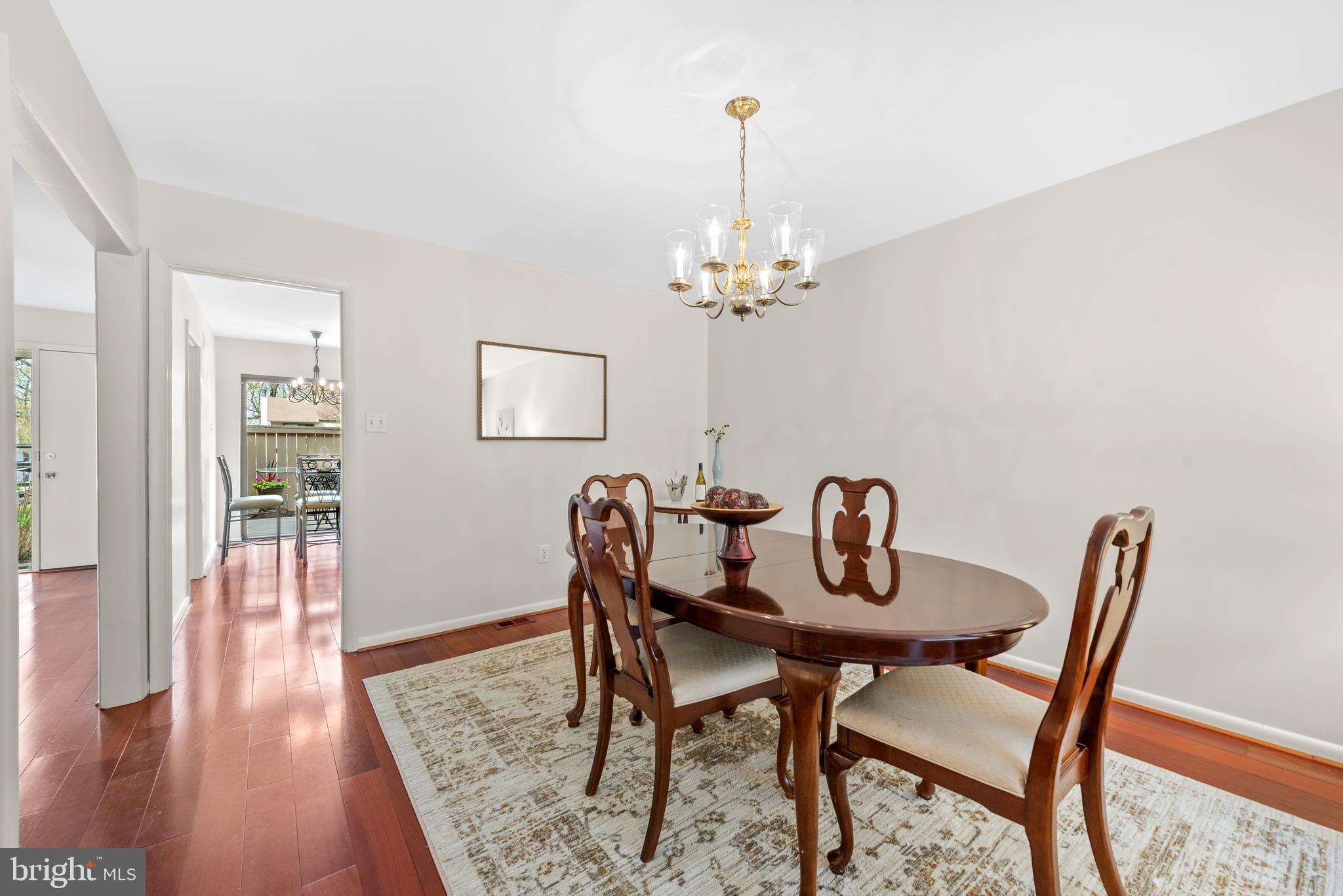 11711 Newbridge Court Reston, VA 20191 - Photo 13 of 37 a view of a dining room with furniture and wooden floor